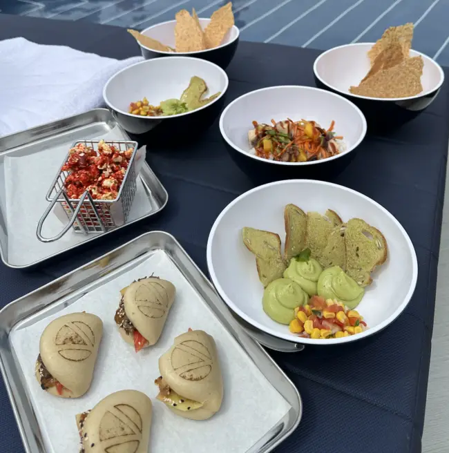 Bowls of guac, popcorn and boa buns from Sun club cafe